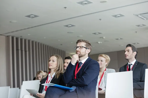 Business people attending seminar — Stock Photo, Image