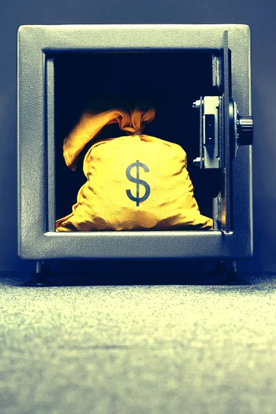 Sack with dollar symbol in safe — Stock Photo, Image