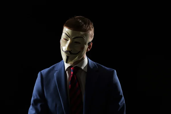 Businessman under anonymous mask — Stock fotografie