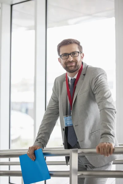 Confident businessman in convention center — Stock Photo, Image