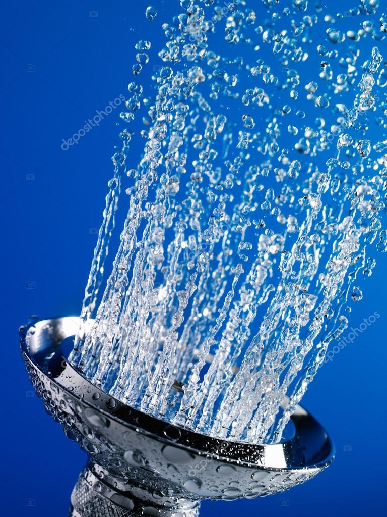Water flowing out of chrome shower head — Stock Photo © londondeposit