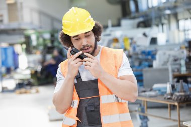 Young manual worker in metal industry  clipart