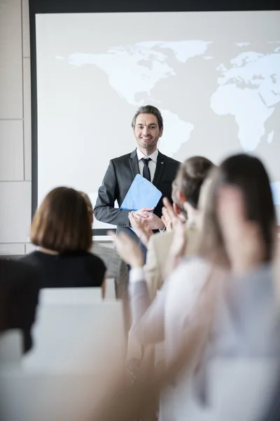 Happy public speaker looking at audience — Stock Photo, Image