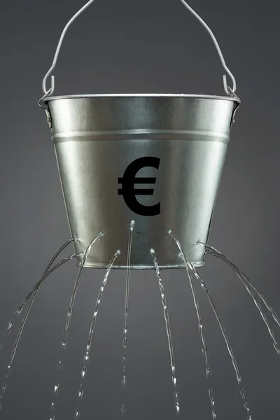 Water leaking from bucket — Stock Photo, Image