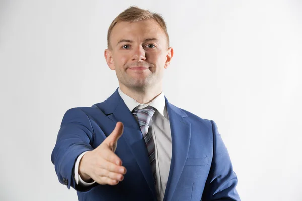 Businessman offering hand — Stock Photo, Image