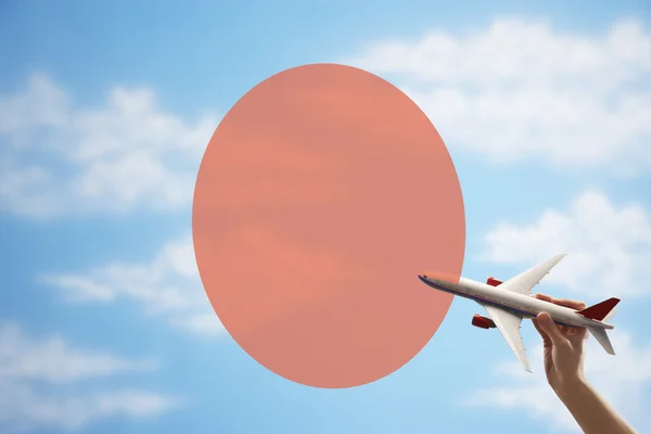 Toy plane in front of Japanese flag — Stock Photo, Image