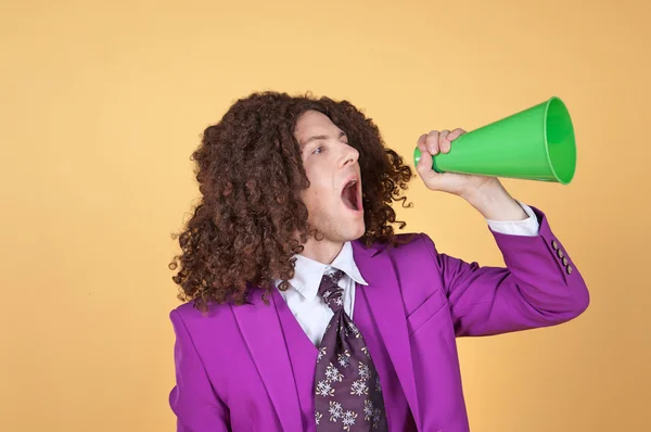 Man with afro shouting from cone — Stock Photo, Image