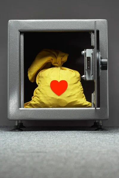 Yellow sack in safe — Stock Photo, Image