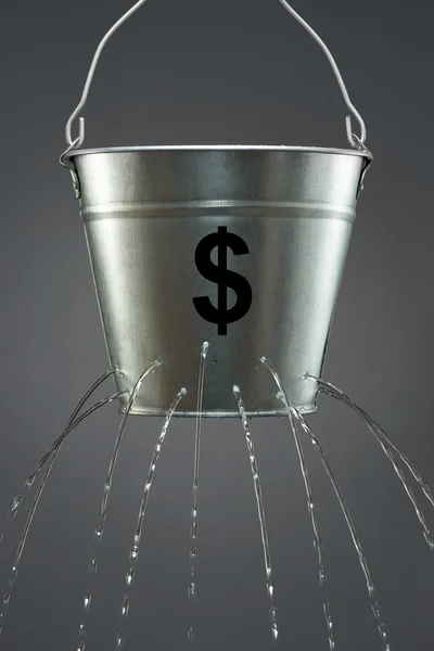Water leaking from bucket — Stock Photo, Image