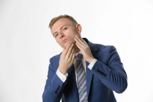 Businessman touching face — Stock Photo, Image