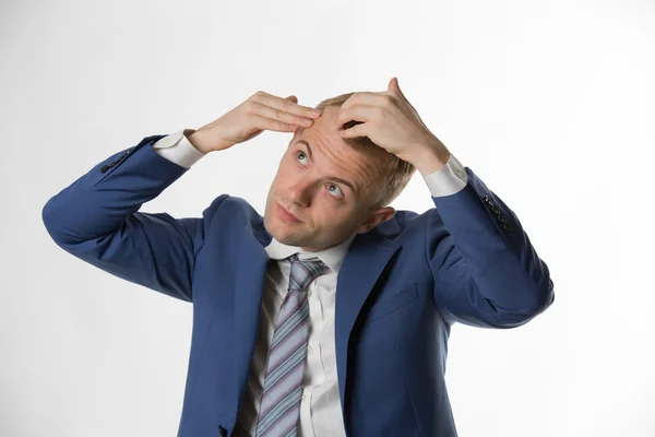 Businessman indicating hair loss — Stock Photo, Image