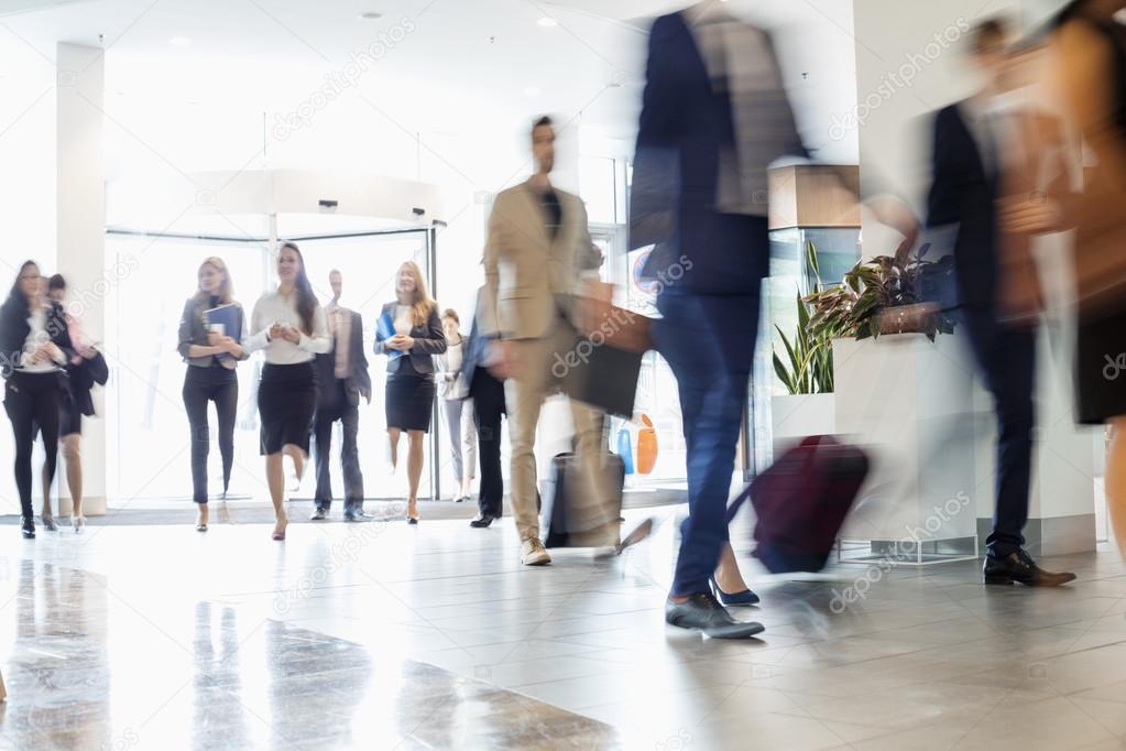 Business people walking at convention center 