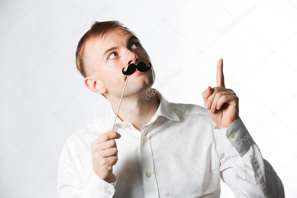 Man wearing fake mustache