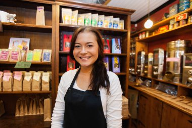 salesperson smiling in coffee shop clipart