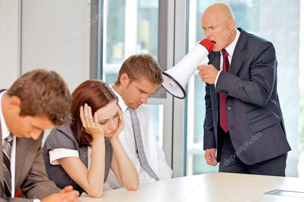businessman screaming on his employee