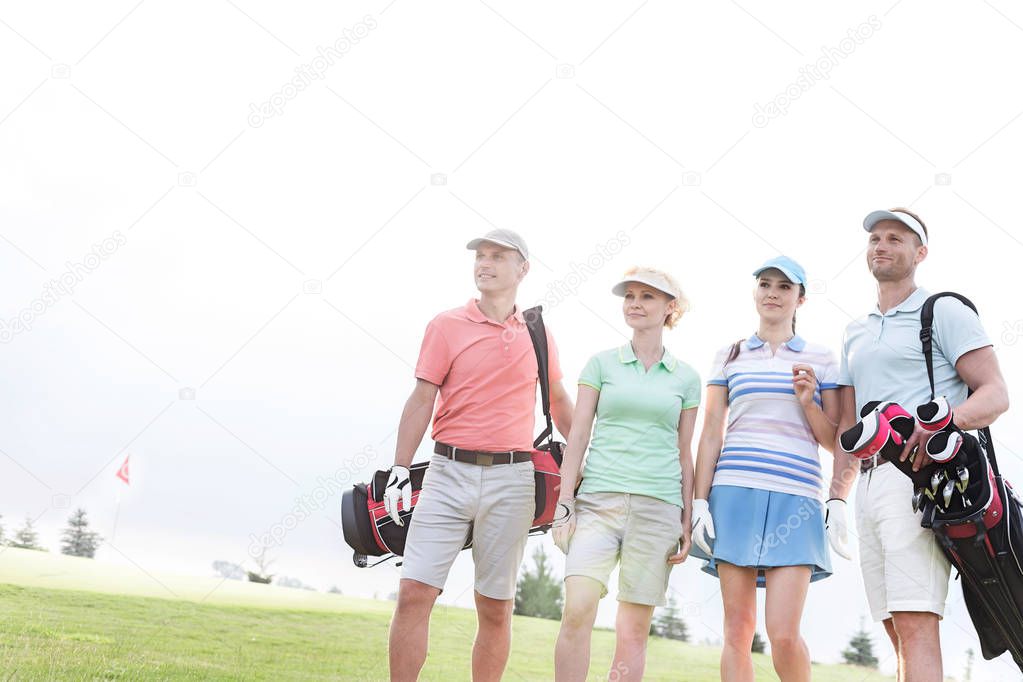 Male and female friends at golf course