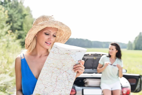 Woman reading map