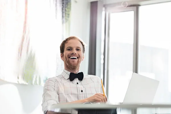Cheerful businessman in creative office — Stock Photo, Image