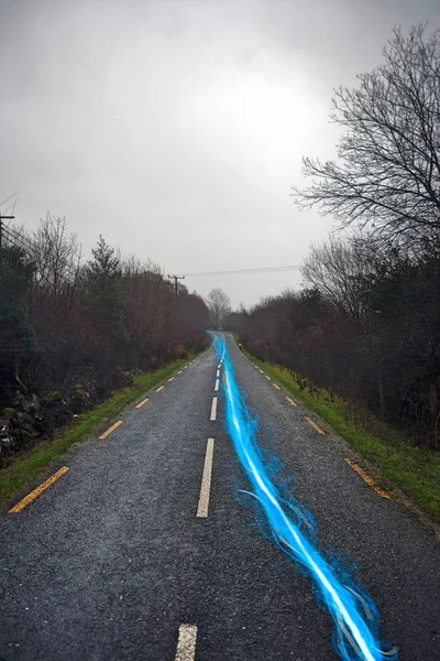 Streak of light on country road — Stock Photo, Image