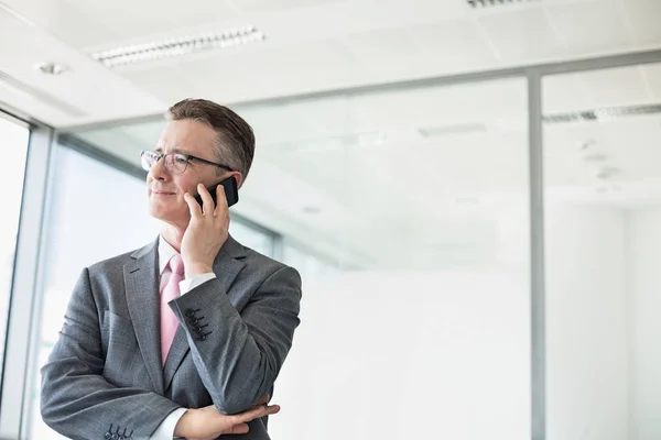 Businessman buttoning sleeve — Stock Photo, Image