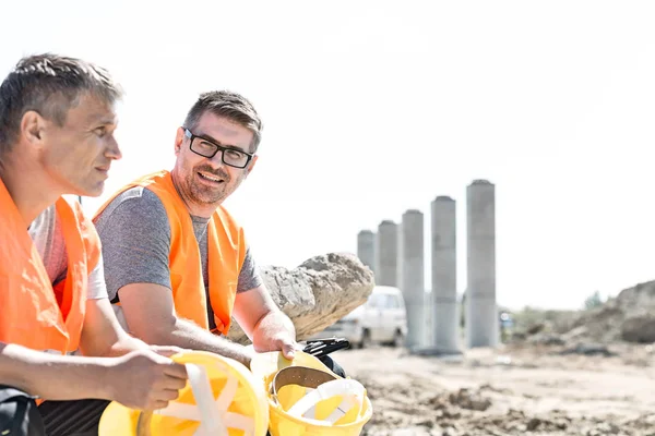 Smiling supervisors at construction site