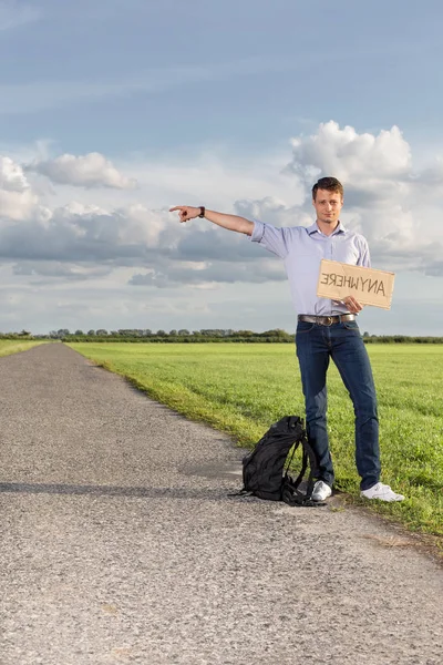 Man with anywhere sign pointing — Stock Photo, Image