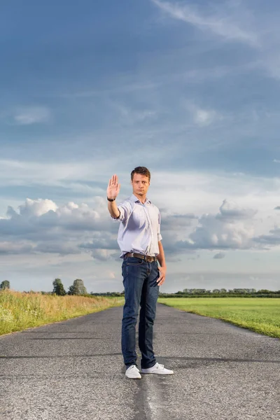 Man holding up hand to stop — Stock Photo, Image