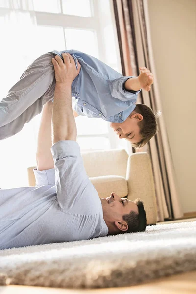 Playful father picking up son — Stock Photo, Image