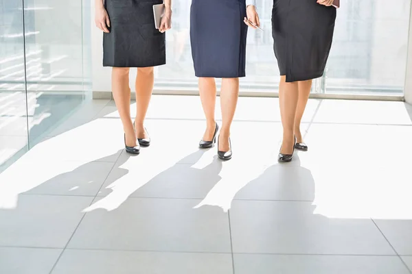 Businesswomen standing in office — Stock Photo, Image