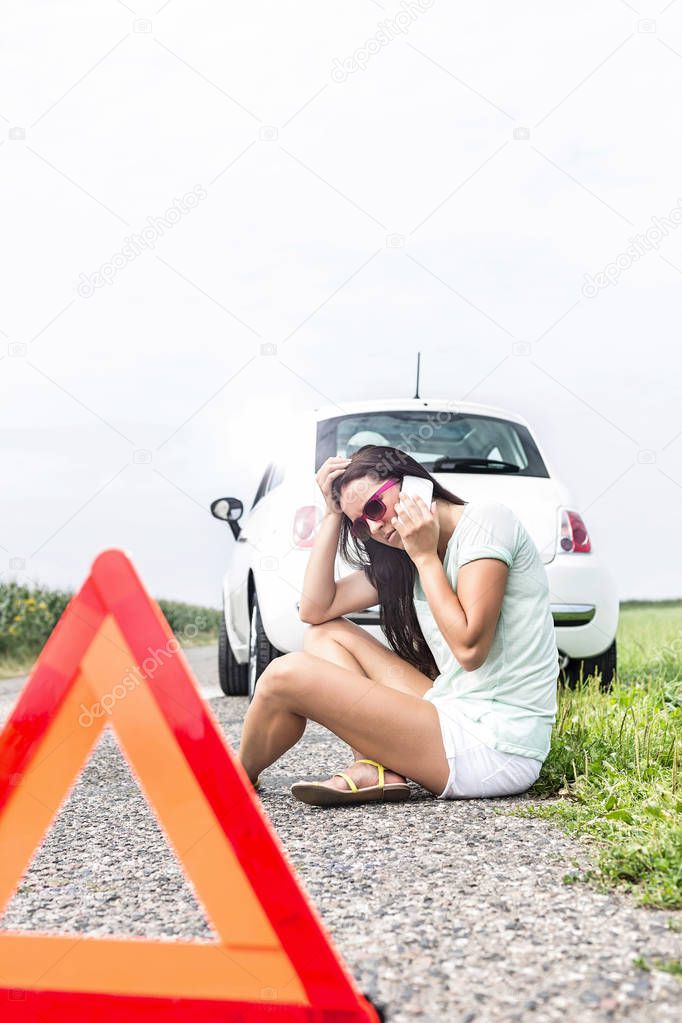 Tensed woman using cell phone 