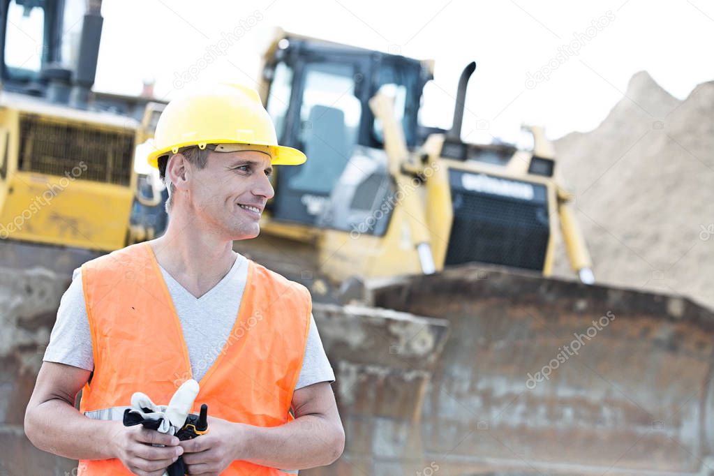 Smiling supervisor at construction site