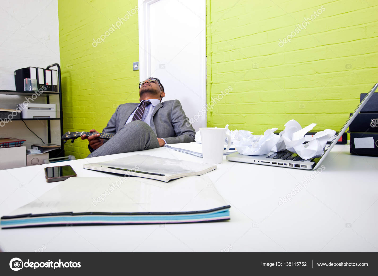 Indian Businessman Asleep At Desk Stock Photo C Londondeposit