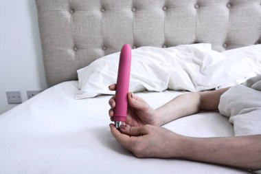 Woman holding a Vibrator Dildo