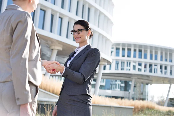 Happy businesswomen shaking hands — Stock Photo, Image
