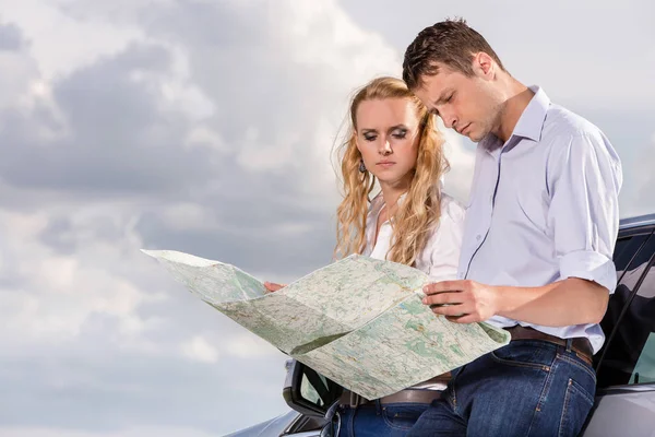 Couple reading map