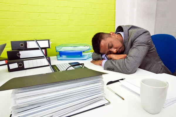 Businessman asleep at desk — Stock Photo, Image