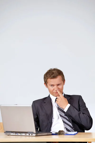 Businessman picking nose — Stock Photo, Image