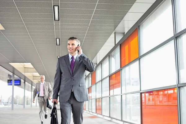 Businessman on call in railroad station — Stock Photo, Image