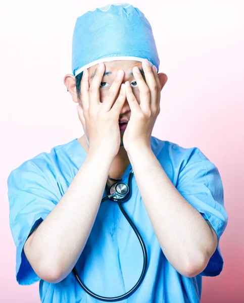 Asian surgeon looking stressed — Stock Photo, Image