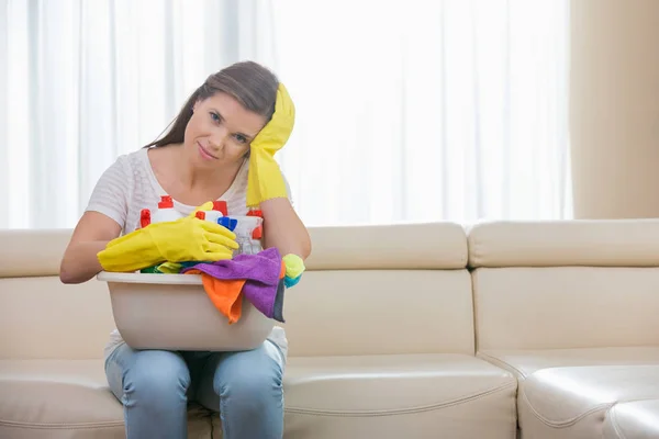 Woman with basket of cleaning supplies