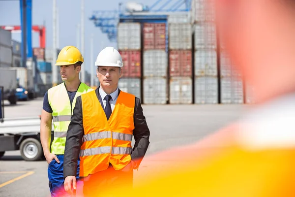 Male workers walking Stock Image