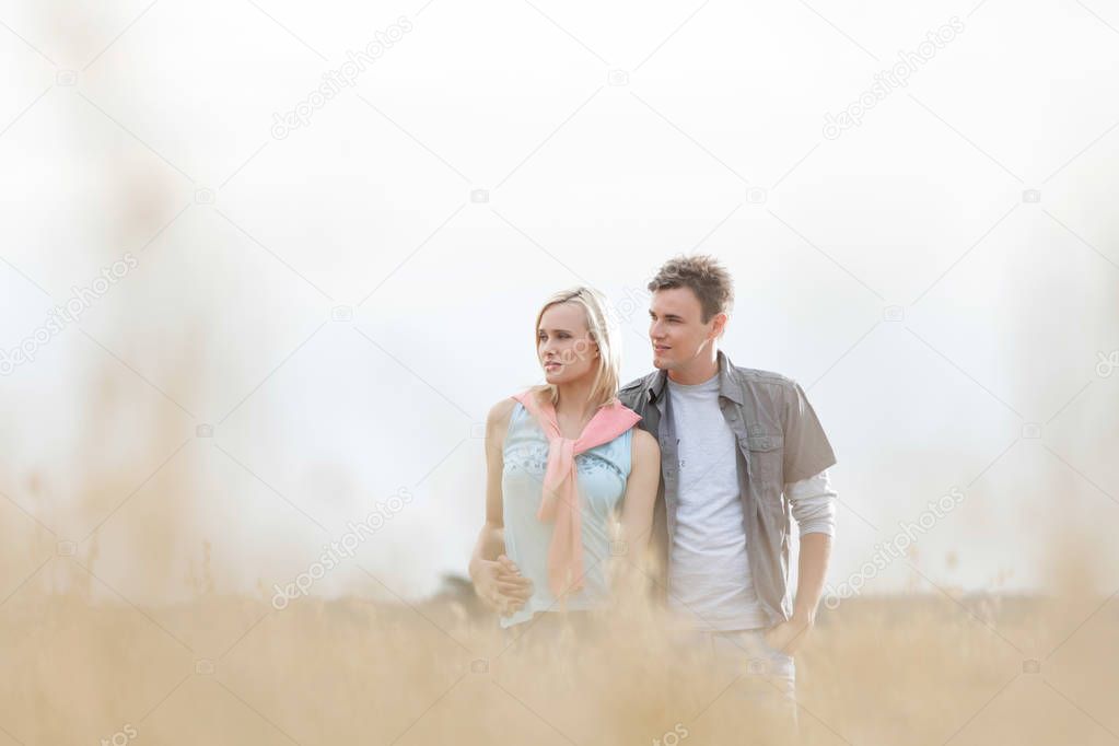 couple standing in field