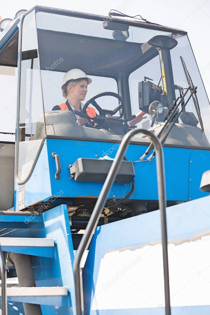 Worker operating forklift truck