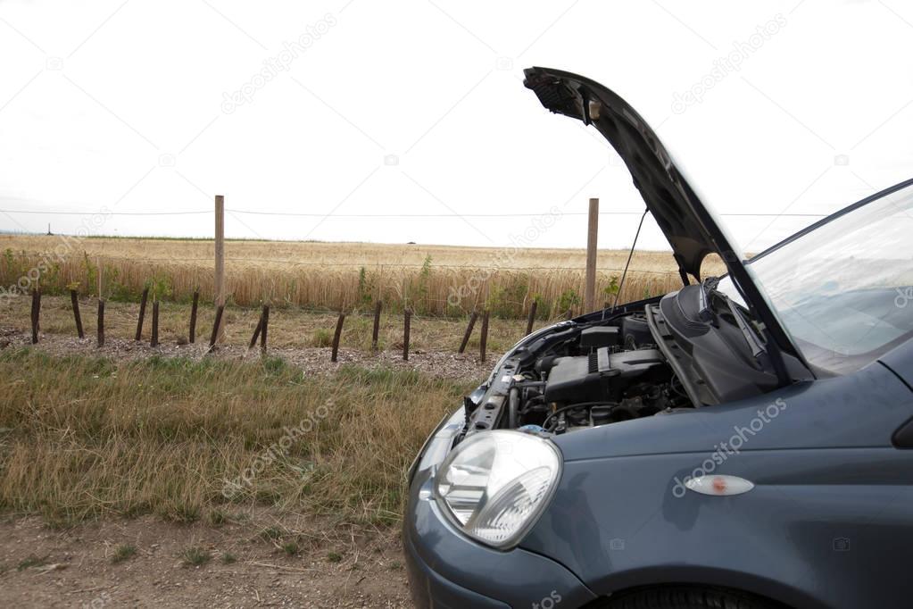 broken car in countryside