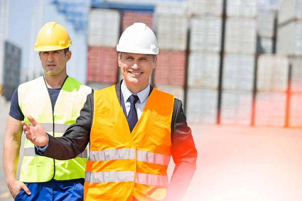 Male workers in shipping yard — Stock Photo, Image