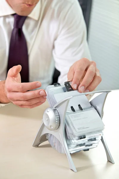 Businessman searching business card — Stock Photo, Image