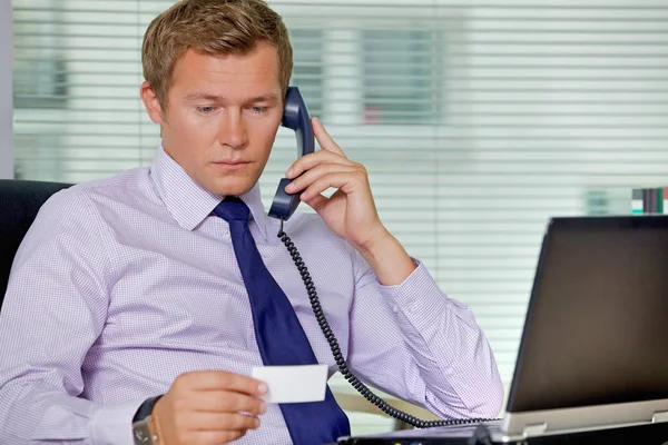 Businessman talking on telephone — Stock Photo, Image