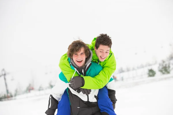 Friends enjoying piggyback ride — Stock Photo, Image