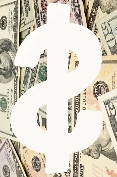Dollar sign over banknotes