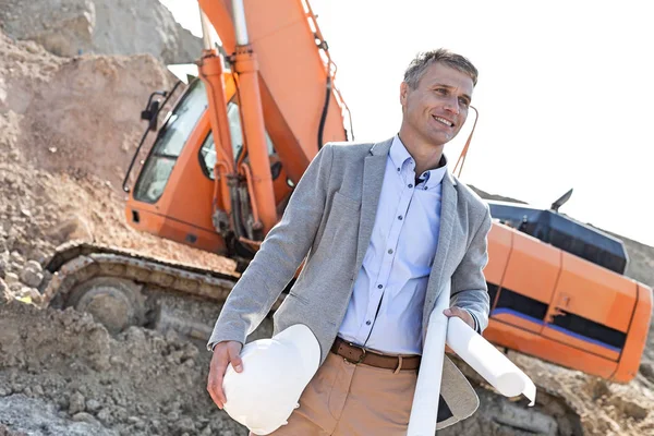 Smiling architect at construction site — Stock Photo, Image